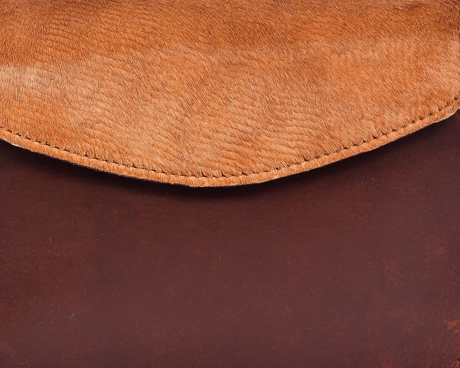 Elevate Your Style with our Brown Leather Sling Bag with Hair-On Detailing. Art: BG-1450